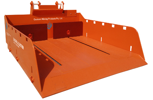 An orange bucket with fully enclosed hydraulic system and two handles on it.